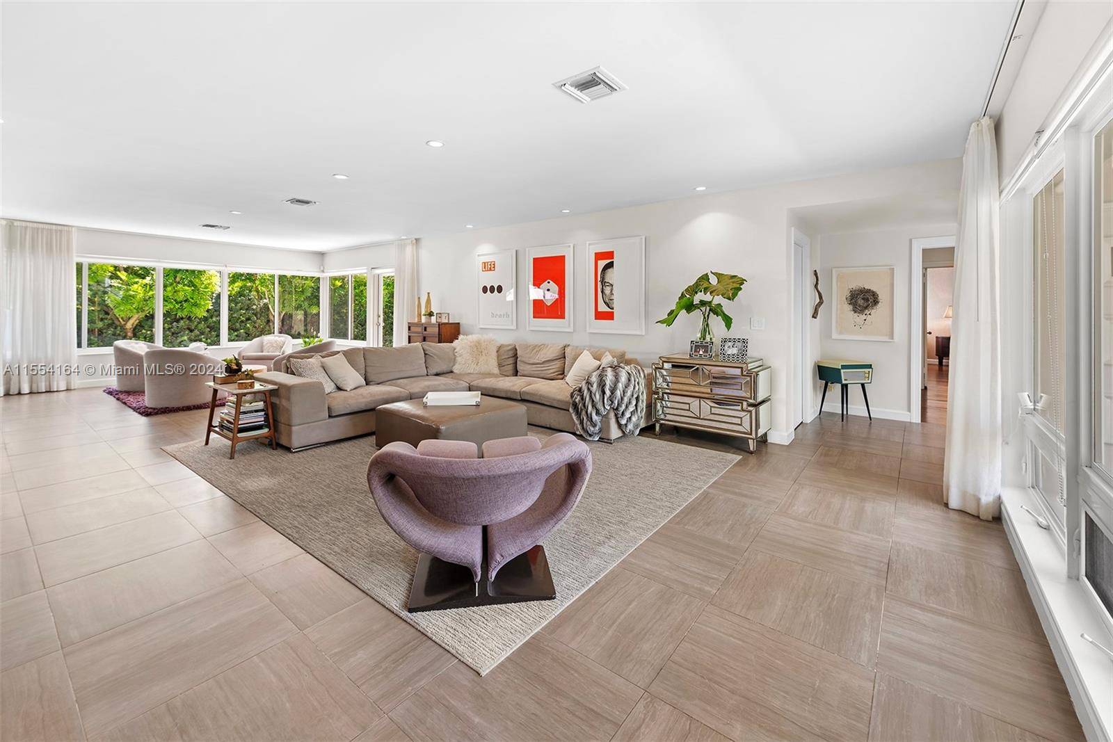 Welcome to this spacious 5 bed, 3 bath home in Miami Beach, where indoor and outdoor living spaces harmonize beautifully.
