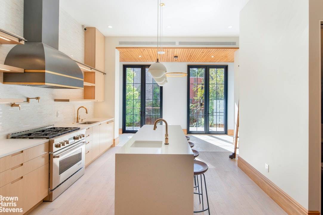 The finest in eco conscious living is yours in this exquisite and innovative three family brownstone sweetly situated in the landmarked district of Clinton Hill !