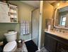 Bathroom with vanity and a stall shower
