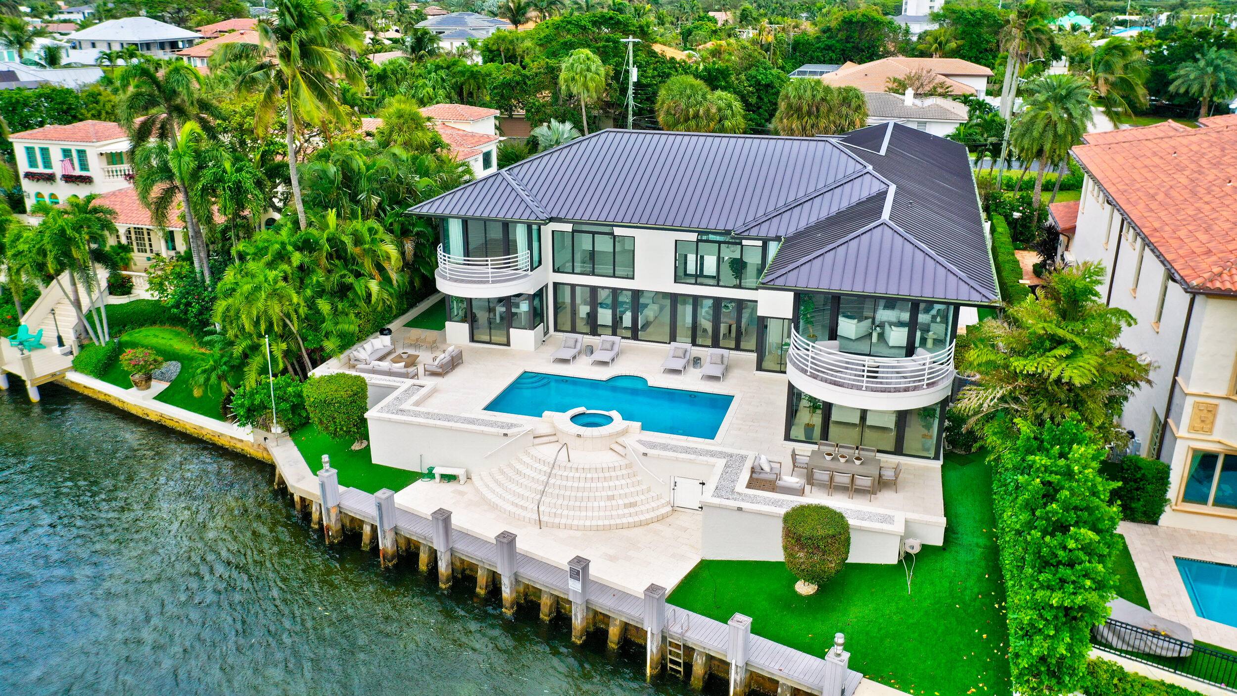 RARE OPPORTUNITY TO LIVE IN THIS ABSOLUTELY STUNNIG CONTEMPORARY HOME DIRECTLY ON THE INTRACOASTAL !