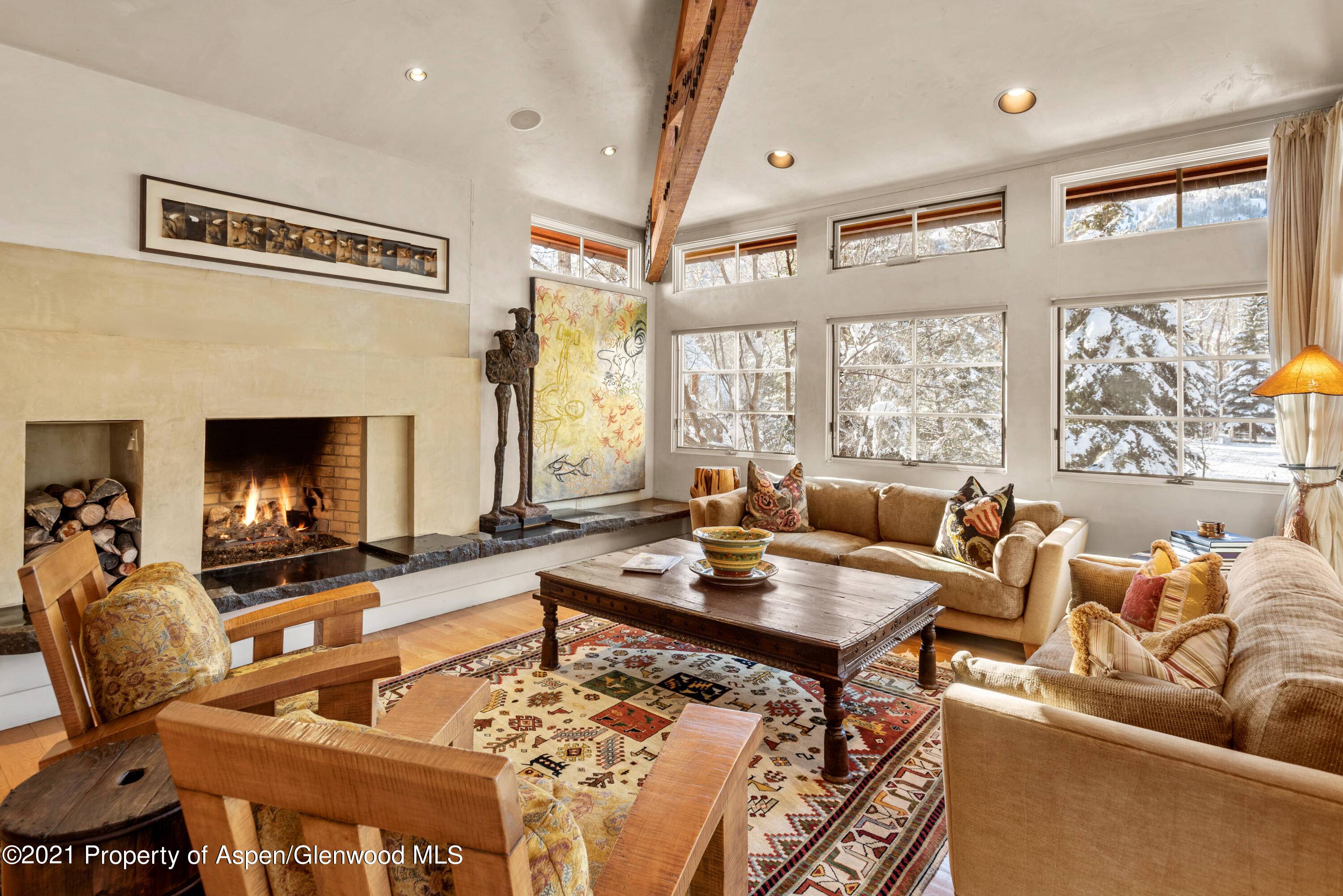 Sophisticated four bedroom Aspen residence offers serene location and breath taking views of the Roaring Fork River and Aspen Mountain.