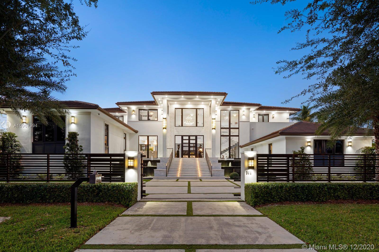 Elegant grand waterfront estate in the gated community of Old Cutler Bay.