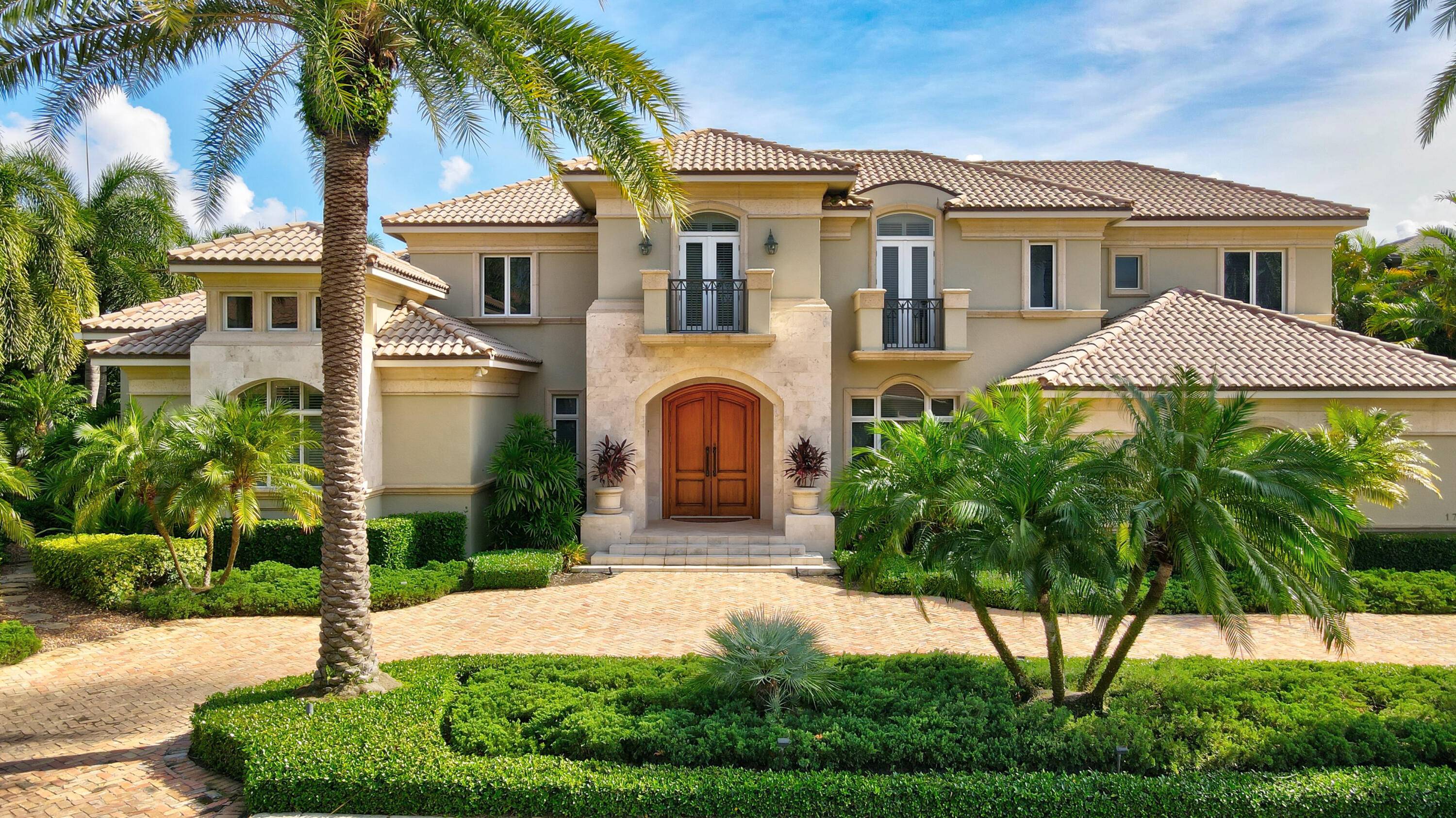 Introducing 174 West Coconut Palm Road ; an exquisite estate situated in one of Boca Raton's most prestigious communities, Royal Palm Yacht Country Club.