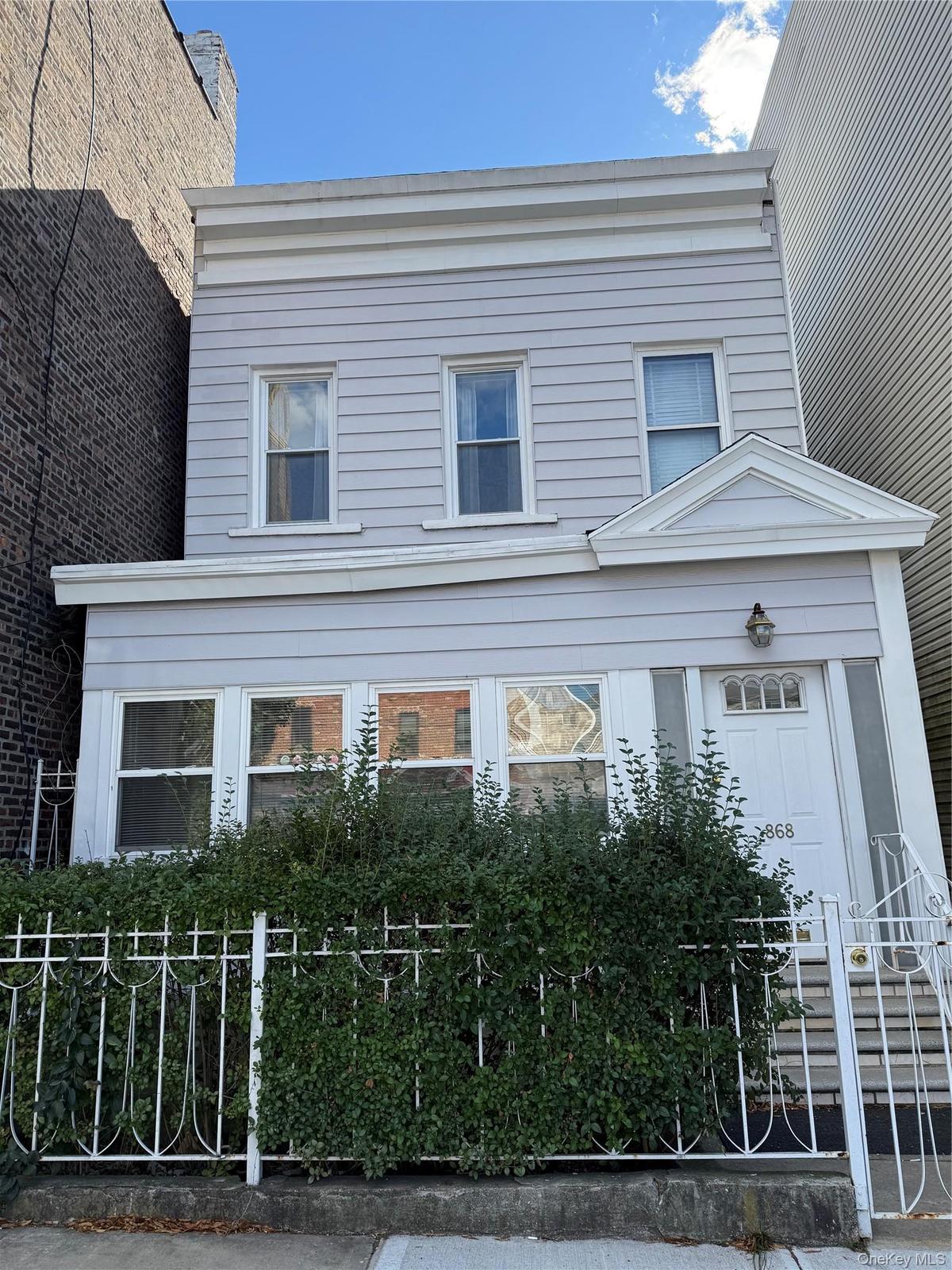 View of front of property featuring a fenced front yard