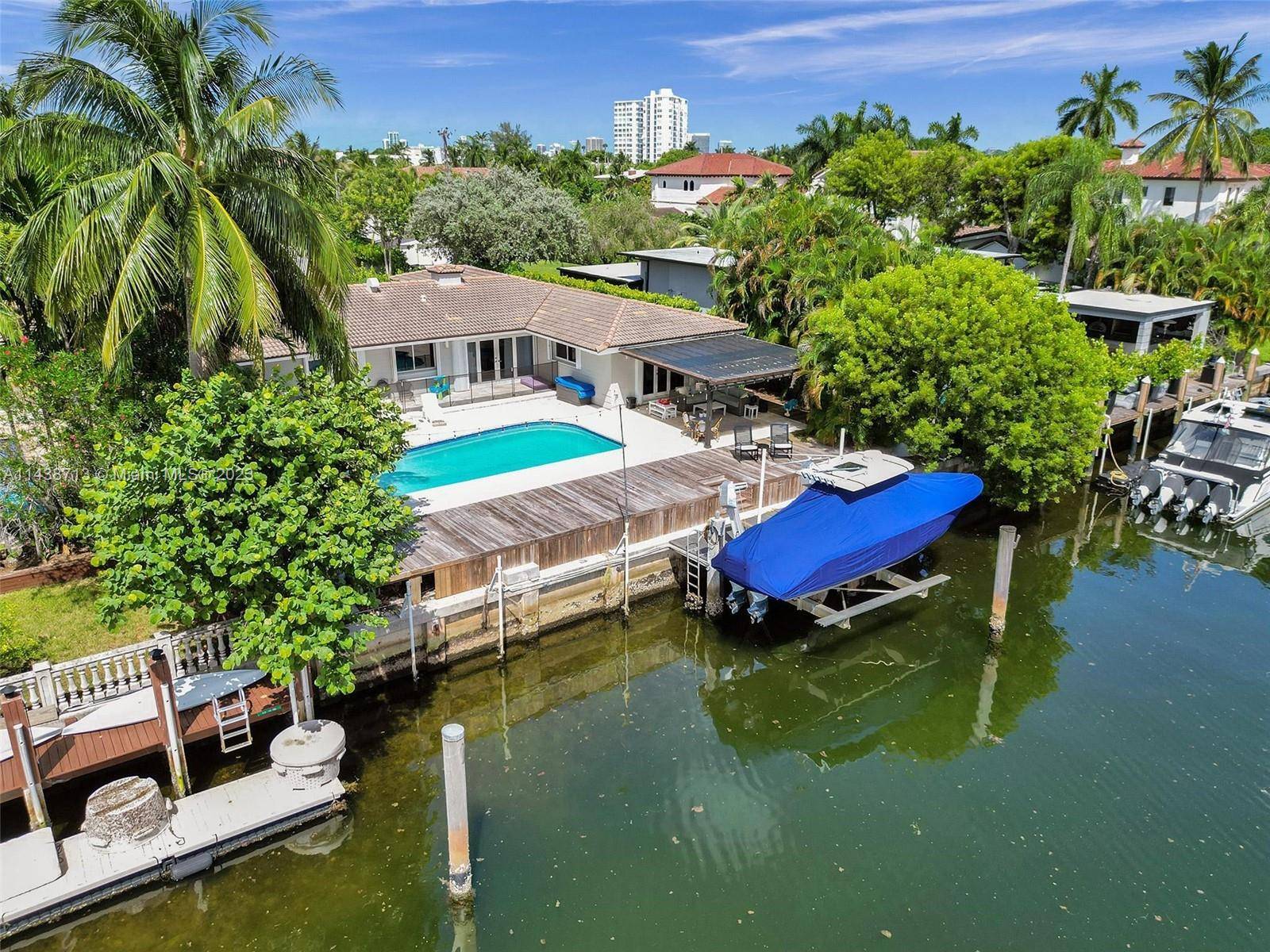 Be ready to fall in love with this beautifully remodeled waterfront home located in the exclusive gated community of Sans Souci Estates.