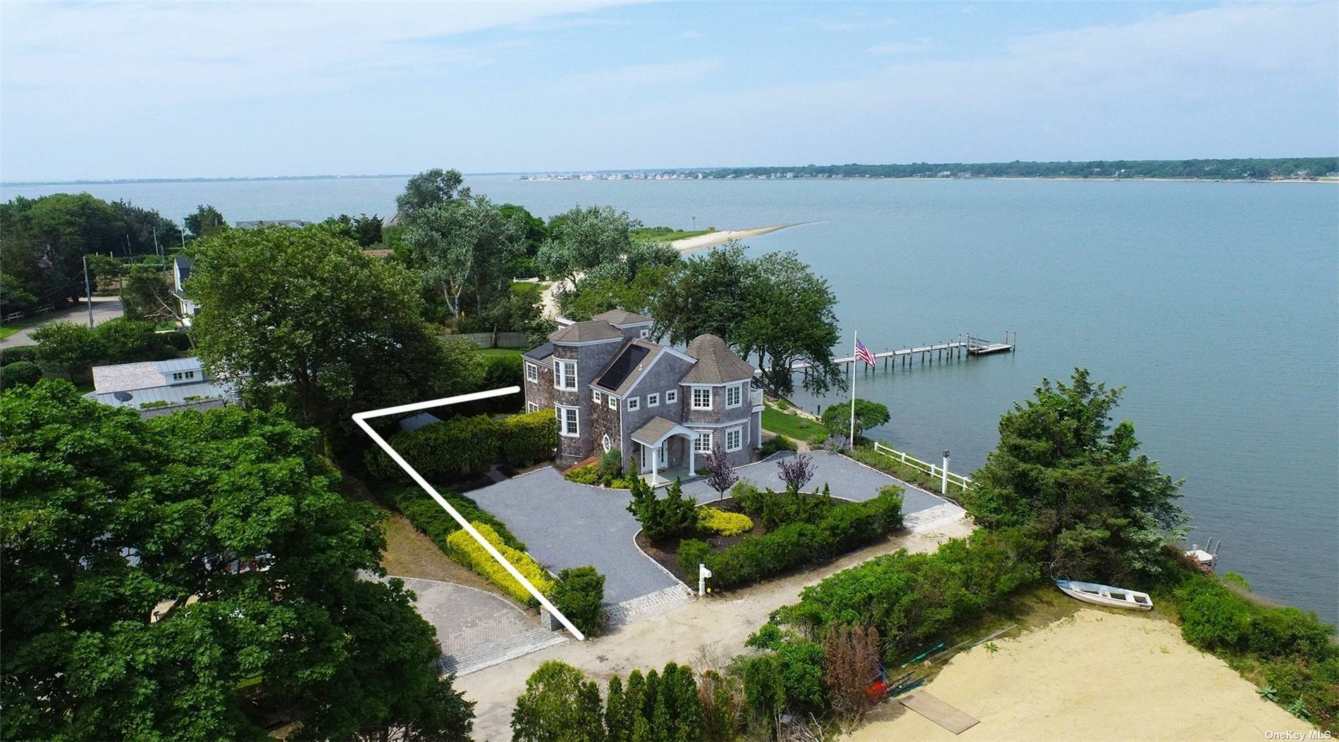 Welcome to the epitome of waterfront living in Hampton Bays !