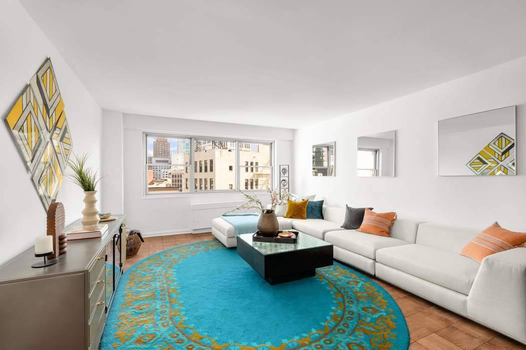 This mid century modern two bedroom, two bathroom at 70 East 10th Street has views over Grace Church and beyond.