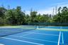 View of tennis court with community basketball court