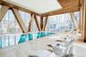 Indoor community pool with a view of city
