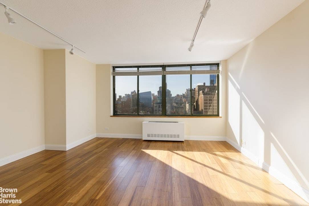 This studio provides everything you could want in a perfect NYC home Tons of streaming light Open sky views from a high floor Newly installed wood floors Open kitchen with ...