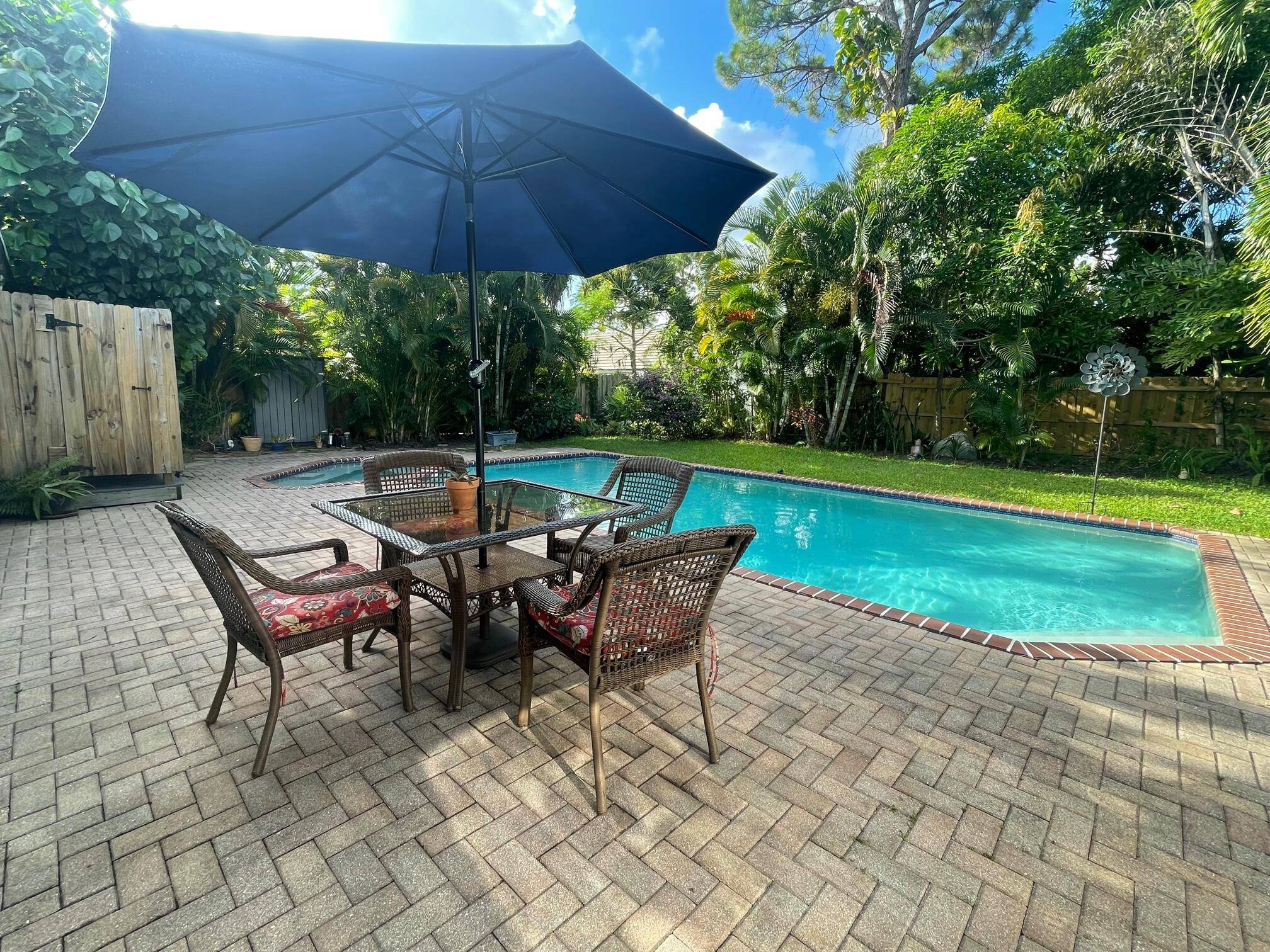 Find more to love in this charming home with private solar heated saltwater pool and spa located on a cul de sac in the desirable Sunflower Delray neighborhood.