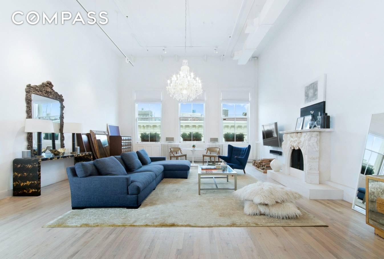 Enjoy every season in Soho with this bright and airy top floor keyed elevator loft with a private terrace and wood burning fireplace.