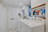 Laundry Room- Washer Dryer & Storage off Entry and Secondary En-Suite Private Entrance with Mud Room space