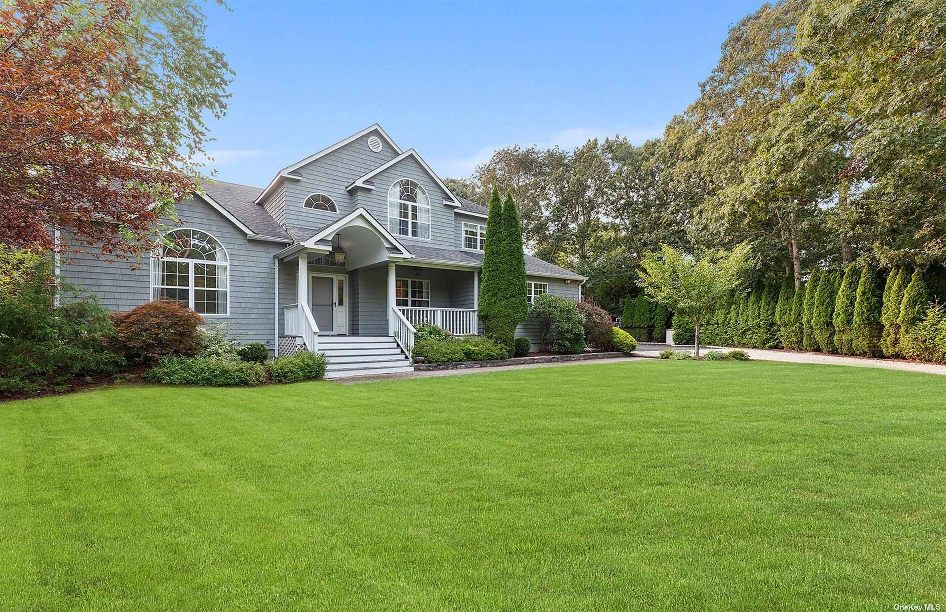 Down a long private driveway, sits this recently renovated Post Modern home with beautifully landscaped grounds offering 1.