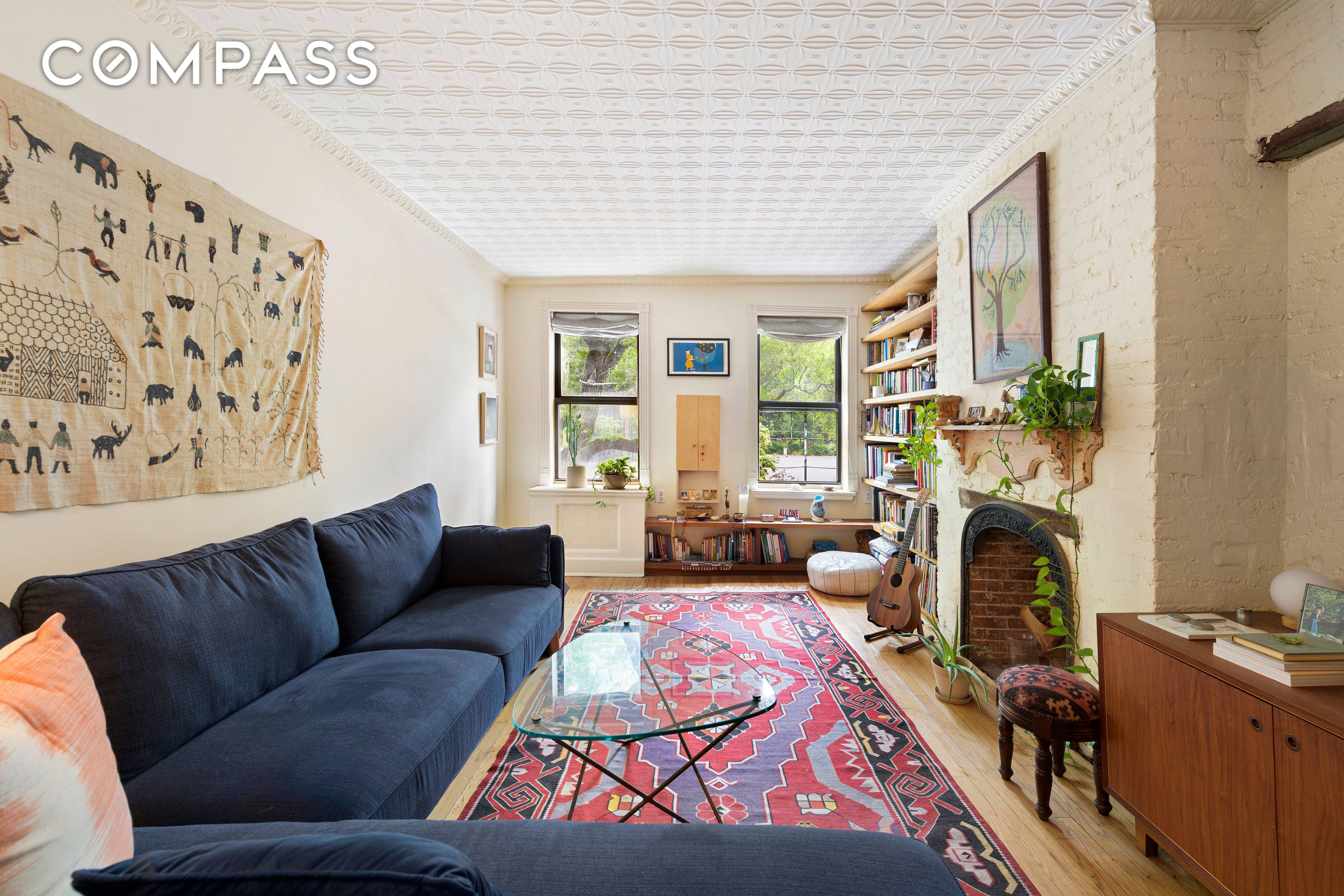 Perfectly situated at the top of Tompkins Square Park, with treetop views from the large living room, this Billy Cotton designed one bedroom exudes East Village charm.