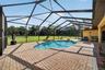 xpansive Covered & Screened Lanai with Paver Pool Deck