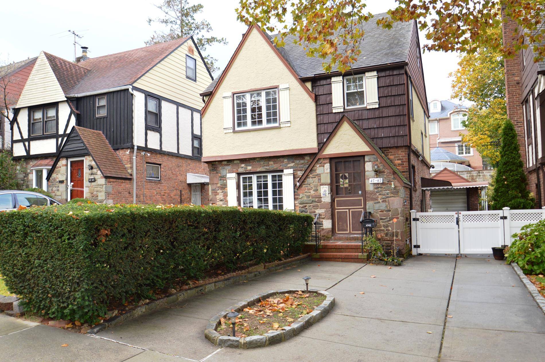 Well maintained 4 bedroom Tudor Colonial on a beautiful tree lined street in desirable Douglaston Park.