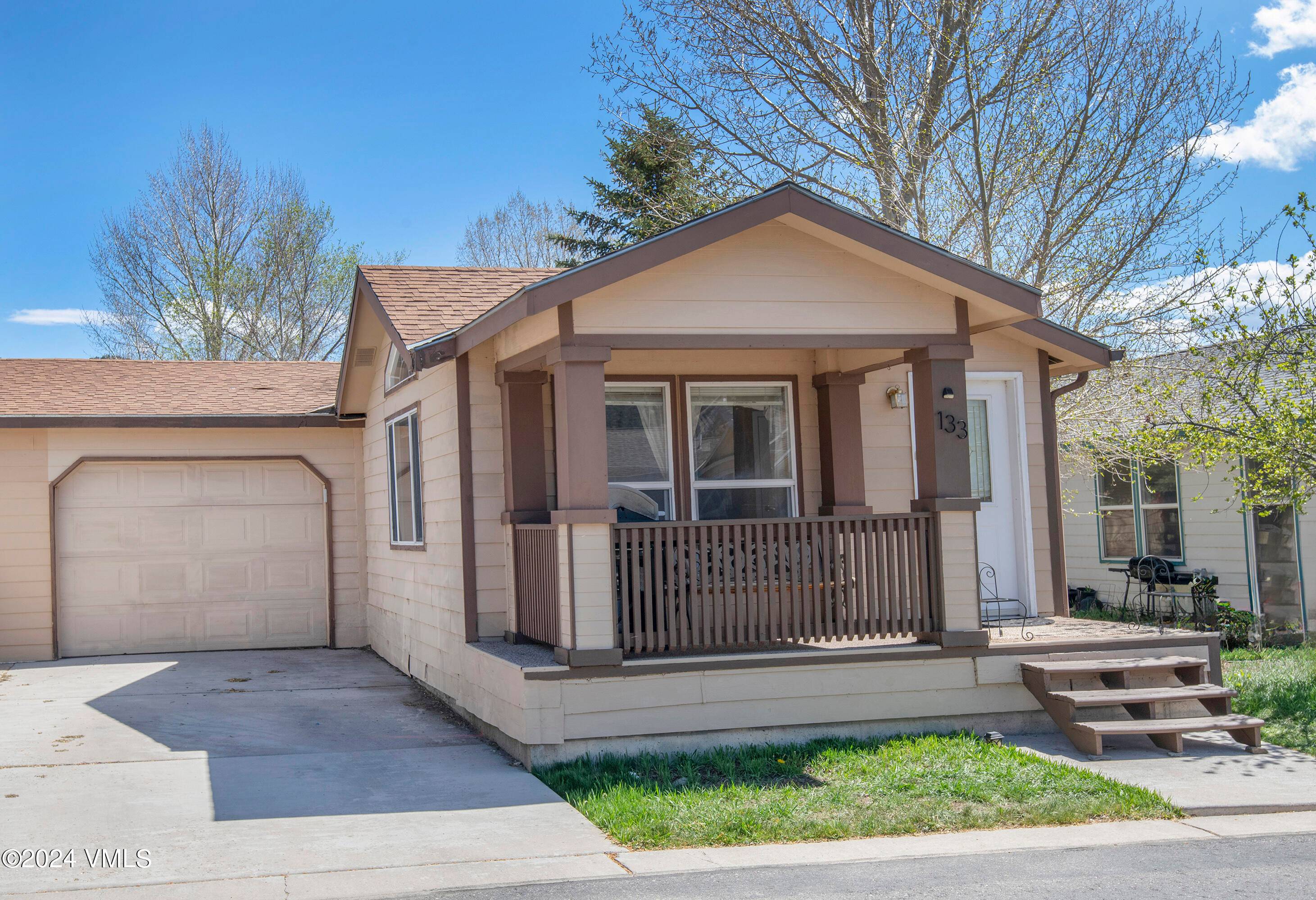 This charming home features three bedrooms and two bathrooms, complete with an attached garage, centrally located in desirable Two Rivers Village.