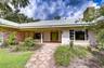 Timeless custom architecture with inviting curb appeal.