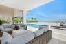 Covered seating area near the Spa and Pool provides shade and sweeping Gulf views