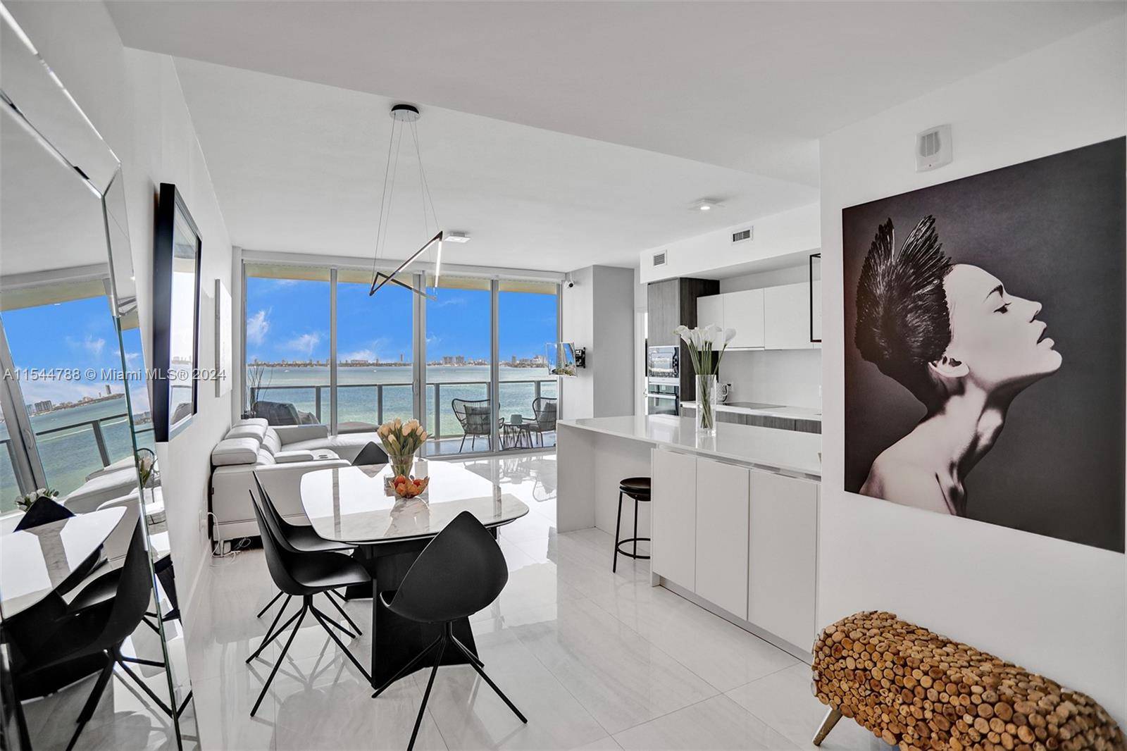Live in a designer two bed unit in the sought after Biscayne Beach Condominium.