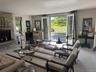 Living area with a stone fireplace