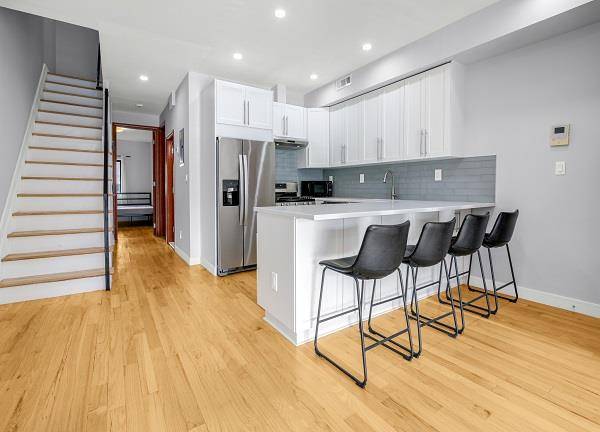 This massive duplex provides all the comforts of a modern townhouse plus PARKING !