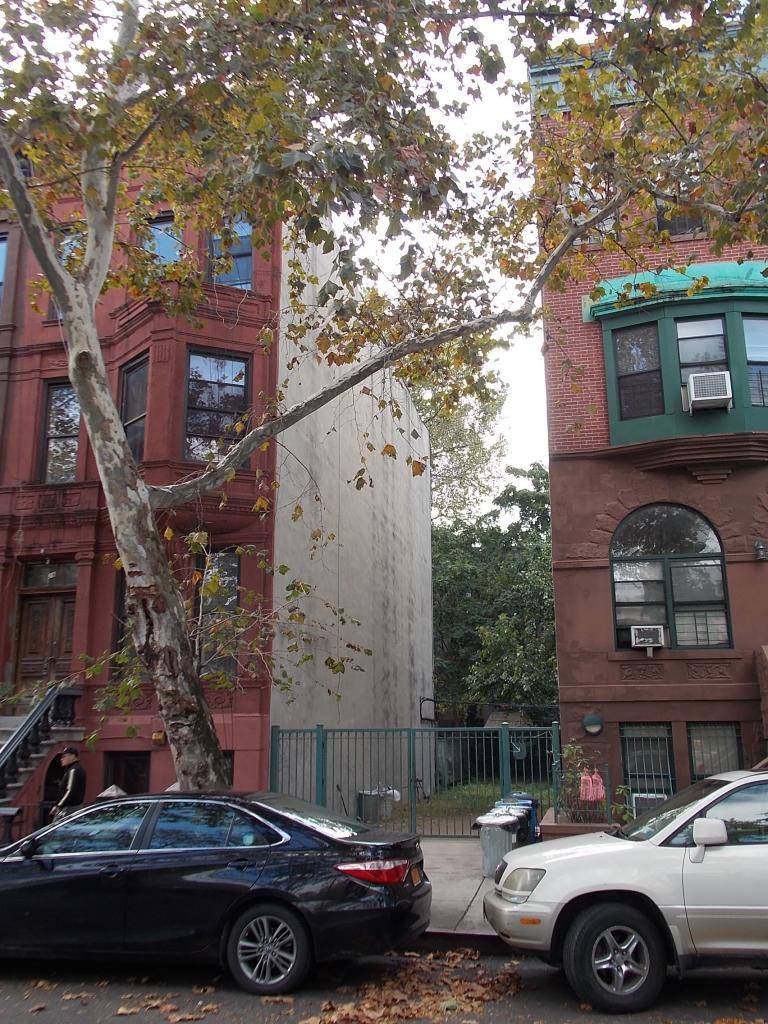 OPPORTUNITY ZONE Situated between 2 brownstones on a tree lined street is a 16.