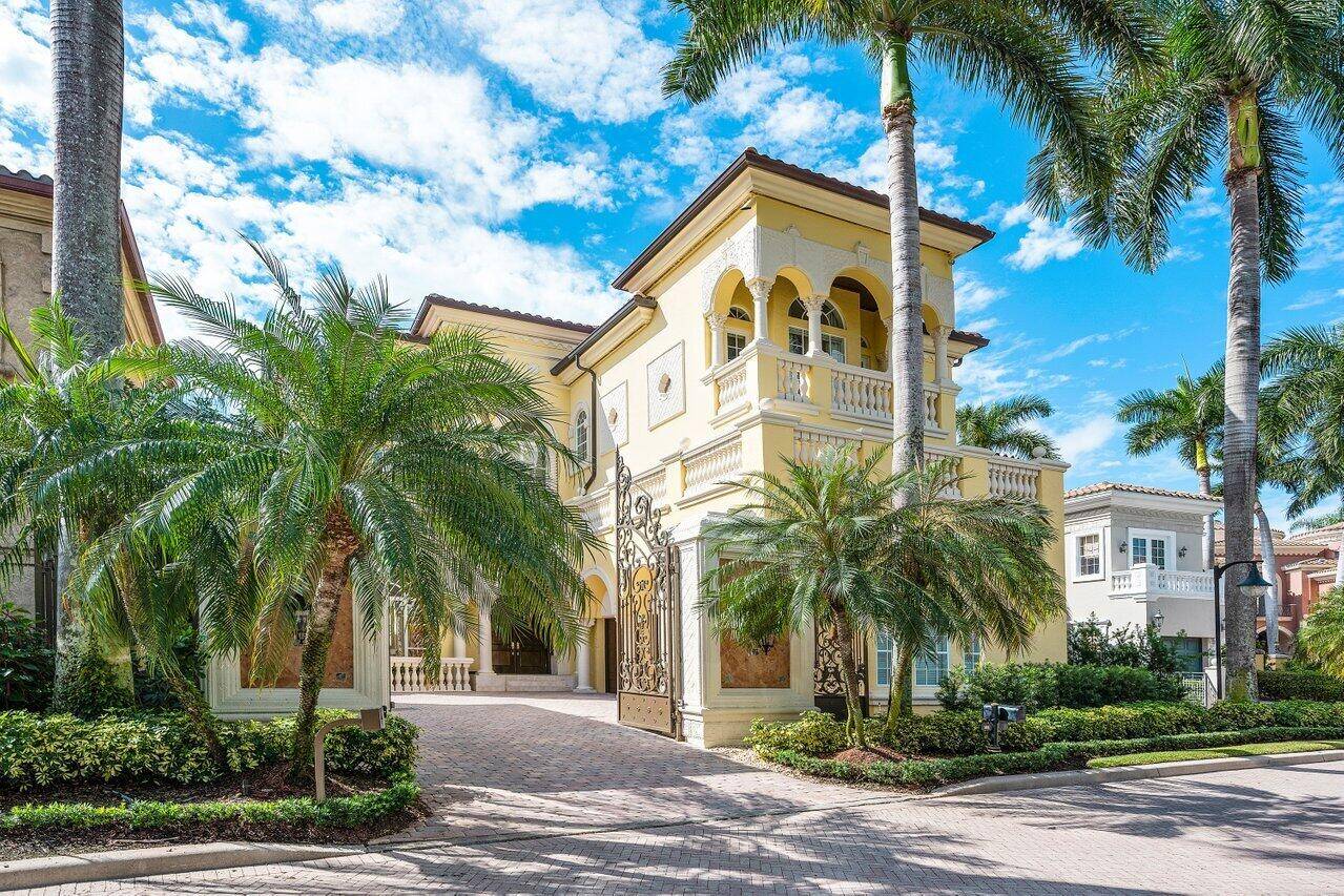 Experience this updated transitional home within the gated privacy of Addison Estates on the grounds of the Boca Raton Club.
