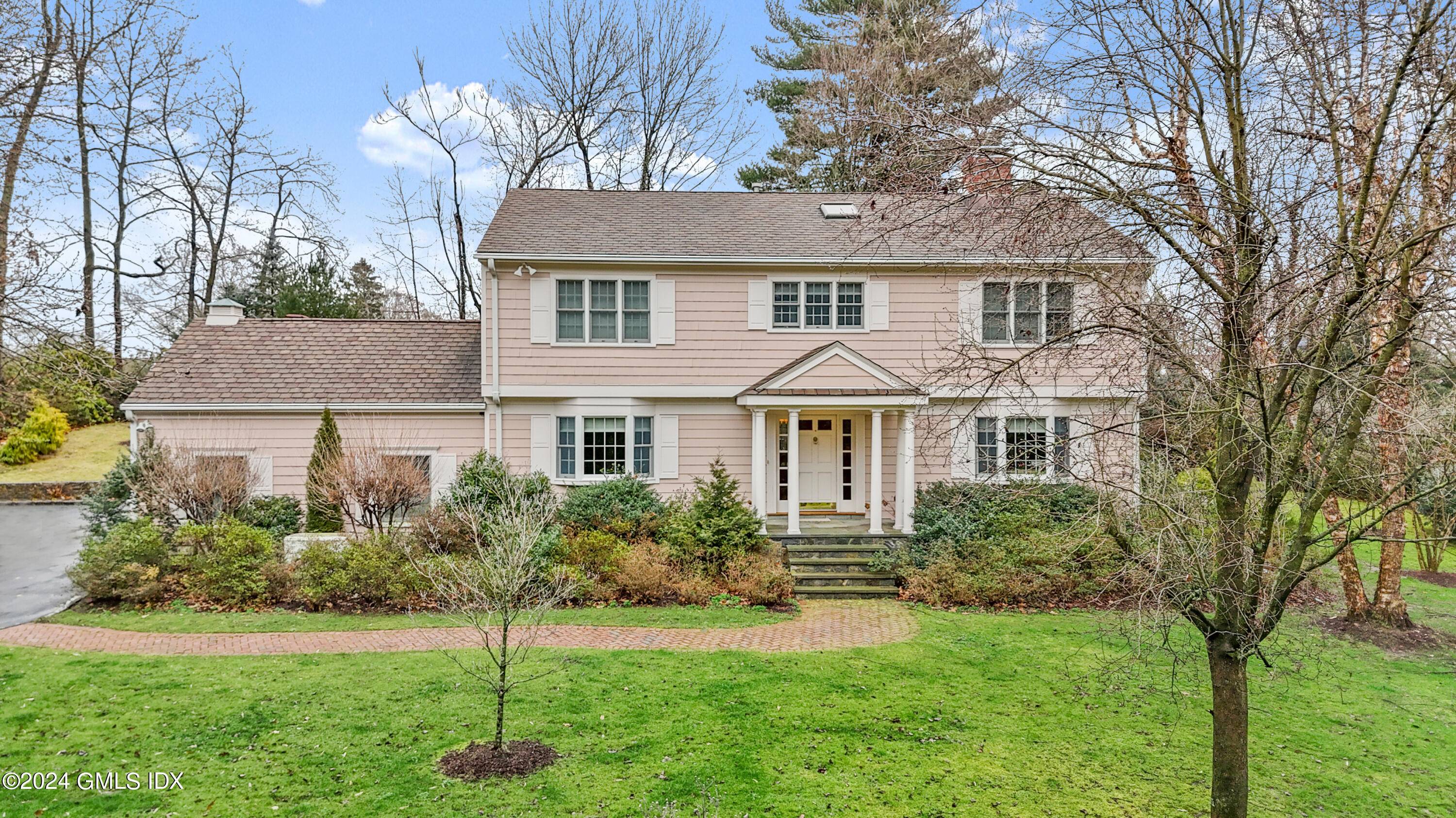 Experience serenity on this private Greenwich property, tucked away down a long driveway yet conveniently close to all the town offers.