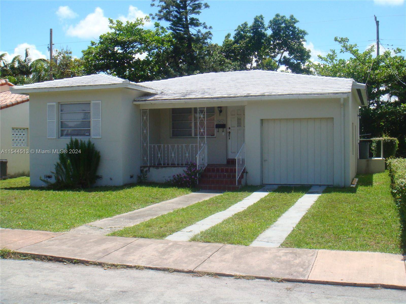 Charming 2 bedroom 1 bathroom home situated on a very private street in north Coral Gables.