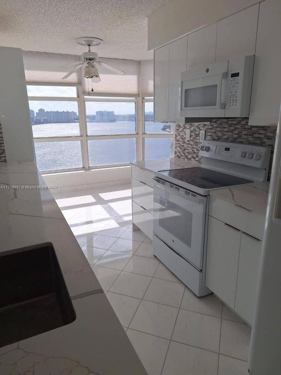 MAGNIFICENT 360 DEGREE WATERVIEWS FROM EVERY ROOM, 3 BEDROOMS 3 FULL BATHROOMS, CORNER UNIT WITH LARGE WRAPAROUND BALCONY, NEW RENOVATIONS IN KITCHEN AND FLOORS, LARGE POOL, GYM, WALKING PATH AROUND ...