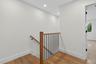 Upstairs - hardwood floor stairs and hallway