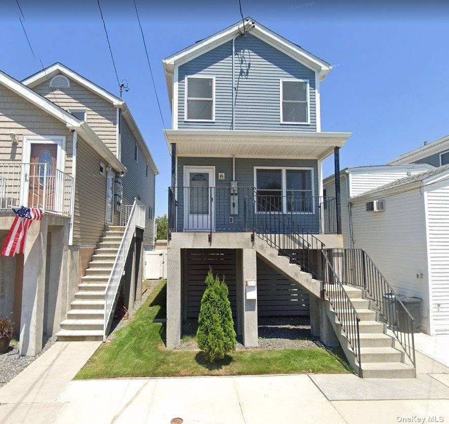 Just move right in ! Welcome to this beautifully renovated raised home in Broad Channel.