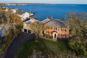 Waterfront Georgian Colonial sited on a spectacular setting enjoys its own private shoreline beach.