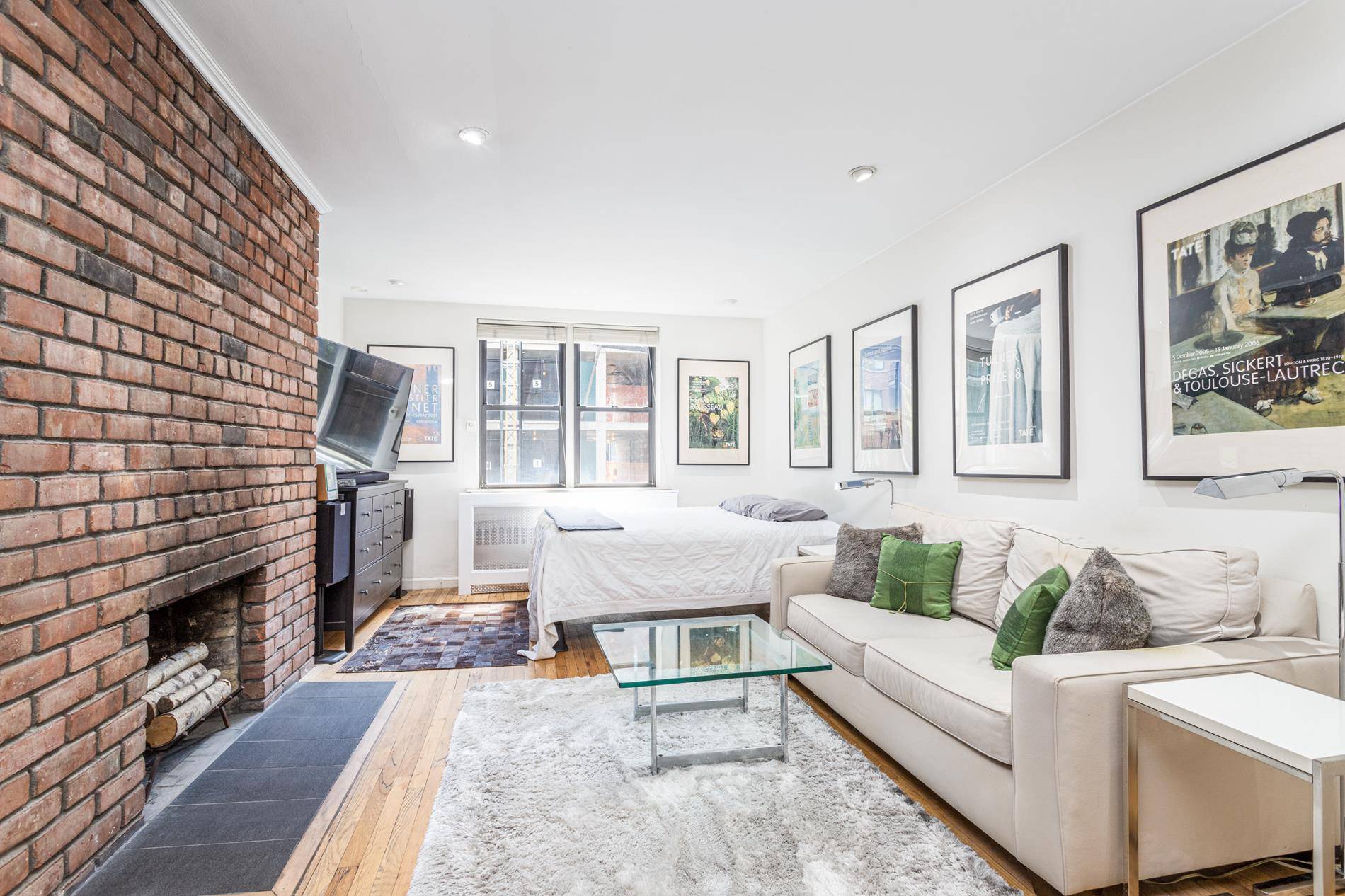 LOW maintenance 769 per month Working fireplace Exposed brick Elevator Building South light and so much more !