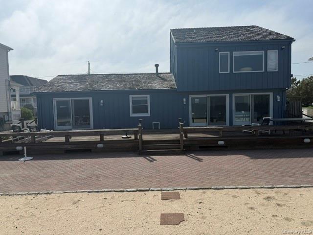 Rear view of property with a deck
