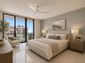 Primary Bedroom w/ Ocean & City Views