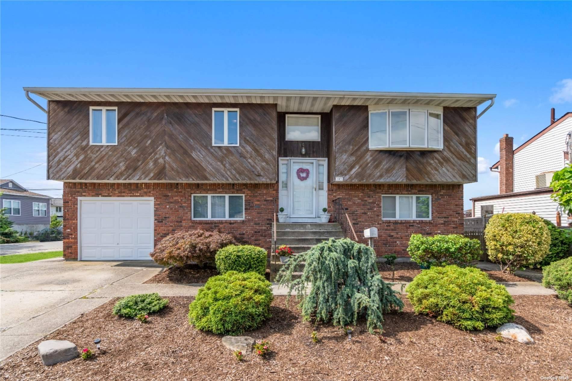 LINDY VILLAGE WATERFRONT over 2300 SF, this Hi Ranch boasts open airy fully updated EIK with Island, Granite countertops, Formal Dining Room with sliders to upper deck overlooking the water.
