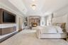 Primary Ensuite | Hardwood Floors | Built-in Unit | Gas Fireplace