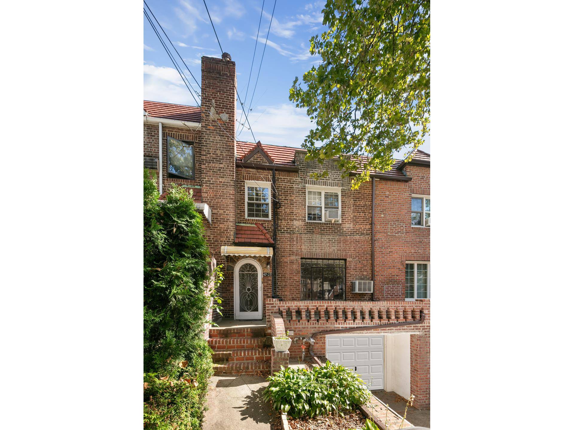 FIRST TIME EVER OFFERED Welcome home to this original 20ft brick townhouse in the heart of Forest Hills.
