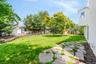 View of grassy yard with a playground