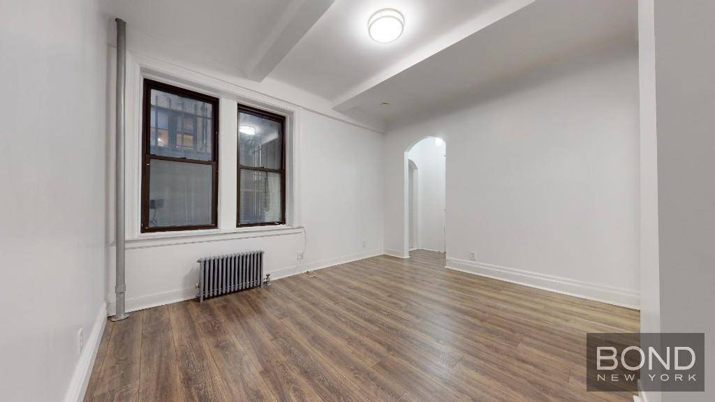 Charming, renovated 2 bedroom apartment with all generously sized room, high ceilings, hardwood floors, separate kitchen, stainless steel appliances, dishwasher microwave, new windows and Prewar details.