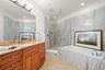 walk-in shower w/new tile walls