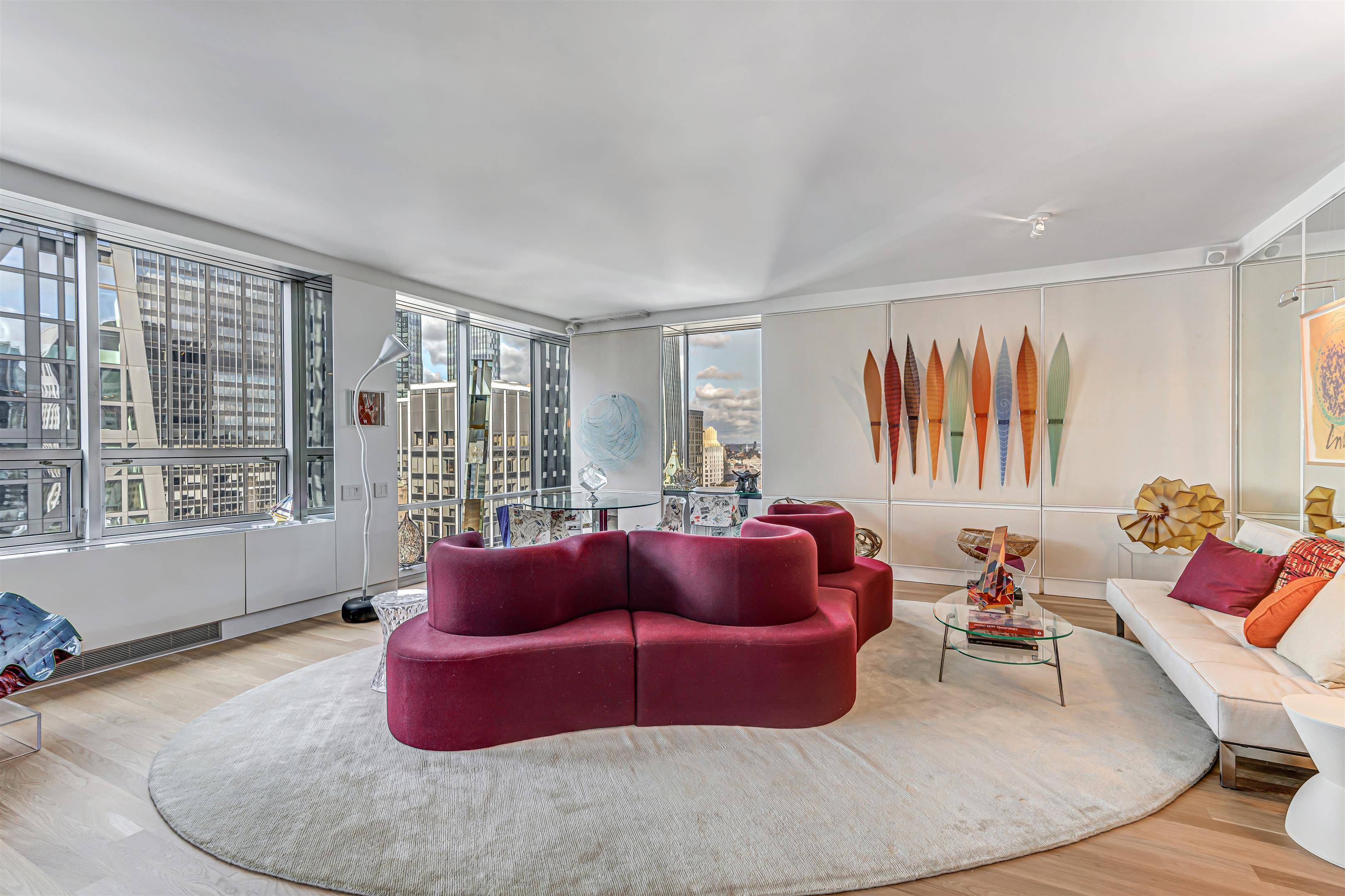 Overflowing with chic and clever design, this oversize 1 bedroom corner condo offers prime views of Central Park, the skyline, and Manhattan s glittering evening lights.