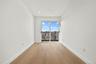 Empty room featuring light wood finished floors and recessed lighting
