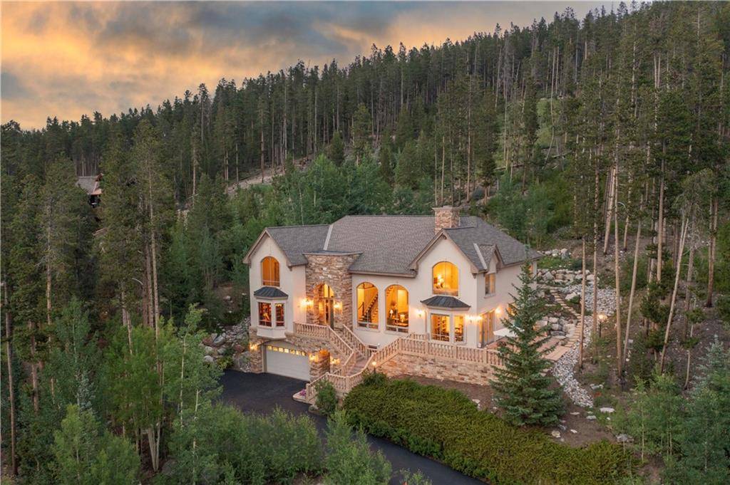Perched on a hill bordering recreation open space, this extraordinary residence offers jaw dropping ski area views from nearly every room.