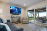 Ground level gameroom and sliding doors to the covered patio and pool deck