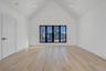 Spacious retreat with vaulted ceilings and large windows, dual walk in closets and primary bath.