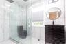 2 nd floorModern bat, hroom featuring a glass-enclosed shower with a rainfall showerhead, white tiled walls with subtle veining, a dark wood-finish va